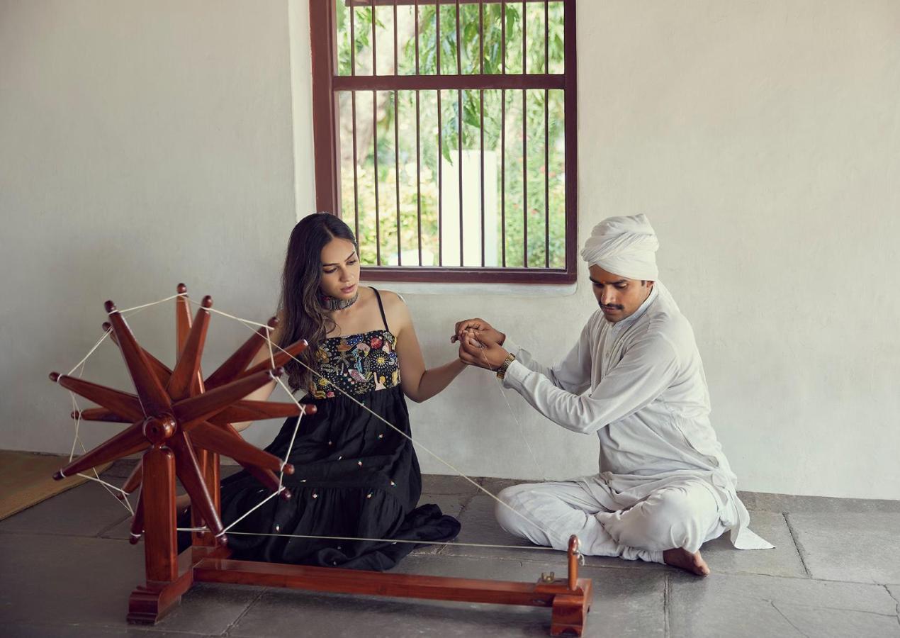 Hyatt Regency Ahmedabad Hotel Luaran gambar A woman learning to spin at Gandhi Ashram